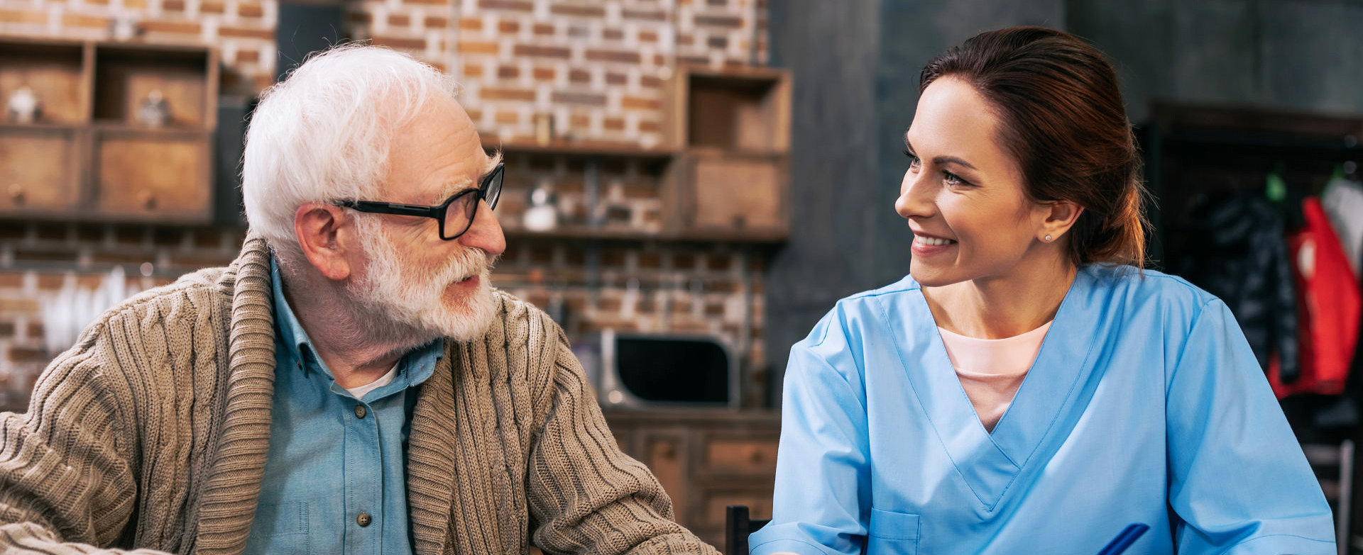 young lady and old man talking