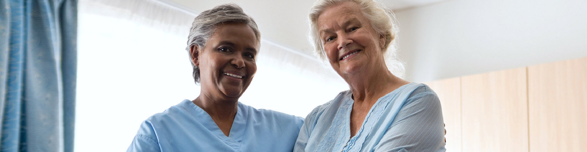 two ladies smiling